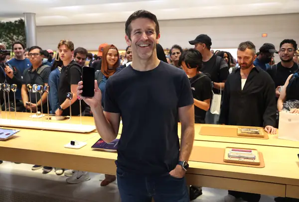 Apple CEO John Ternus holds an iPhone in his right hand during Friday's release of the iPhone 18 Pro in New York City.