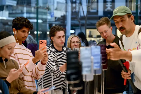Shoppers at an iPhone store in Sydney, Australia.