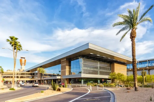 Terminal 3 of Phoenix Sky Harbor airport with palm trees on either side.