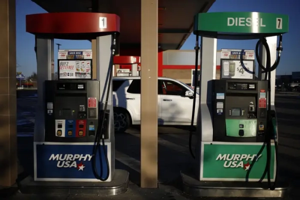 A car sits at a gas station.